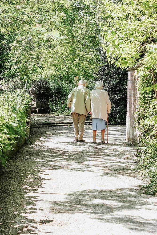 Residents walking in the gardens