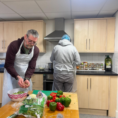 Residents prepare food together
